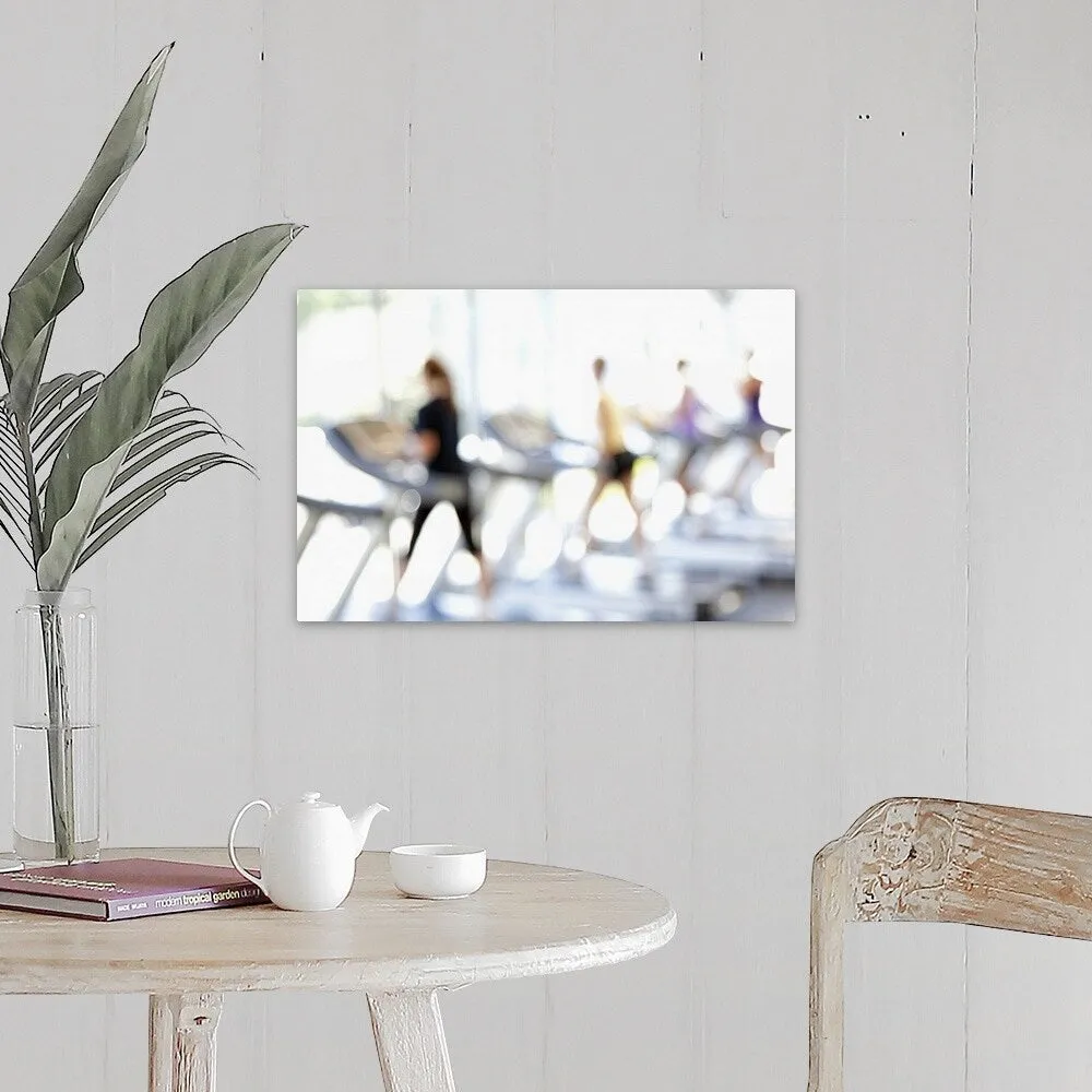 "Defocused view of people on treadmills in health club" Canvas Wall Art