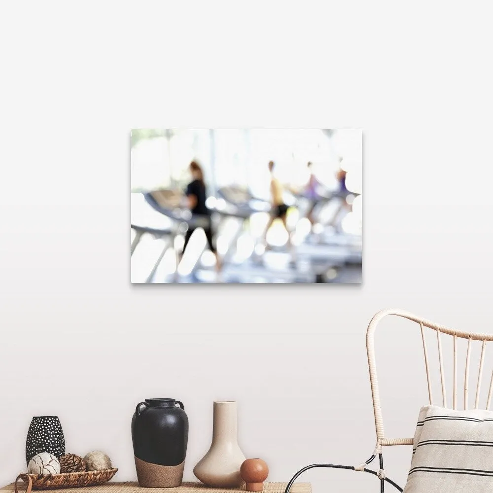 "Defocused view of people on treadmills in health club" Canvas Wall Art