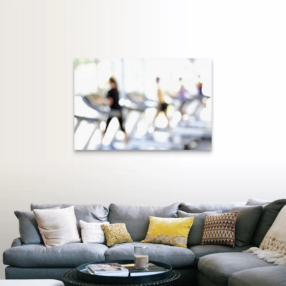 "Defocused view of people on treadmills in health club" Canvas Wall Art