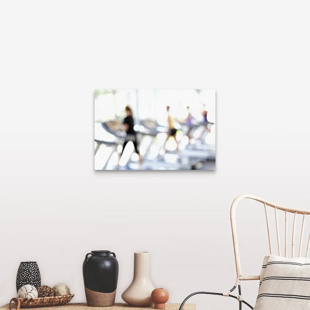 "Defocused view of people on treadmills in health club" Canvas Wall Art