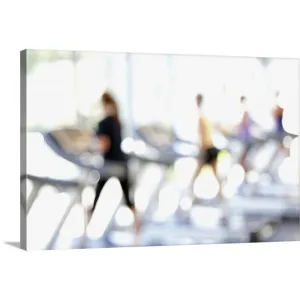 "Defocused view of people on treadmills in health club" Canvas Wall Art
